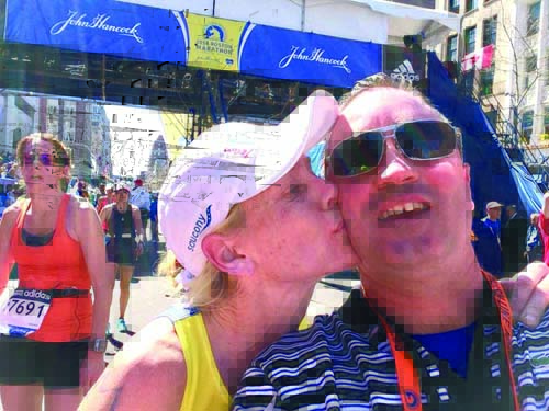 Katy Kelly: Team MR8 marathoner Katy Kelly celebrated at the finish line with her husband Eddie Kelly. “Love completely demolishes what the cowards attempted to try and do to us. This picture symbolizes that love perfectly.” 	Photo courtesy Katy Kelly